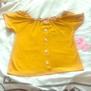 Mustard yellow shoulder shirt with buttons.